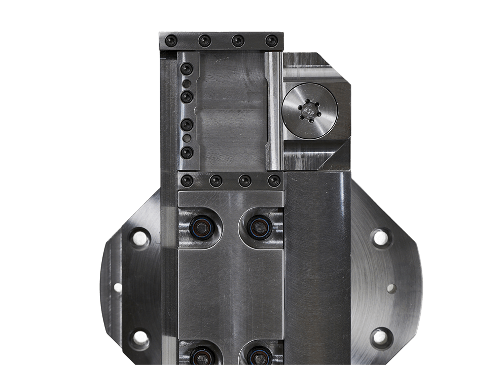 Custom-engineered machined steel assembly with precision-bored bearing seats, socket head cap screws, and modular block construction against a black studio background